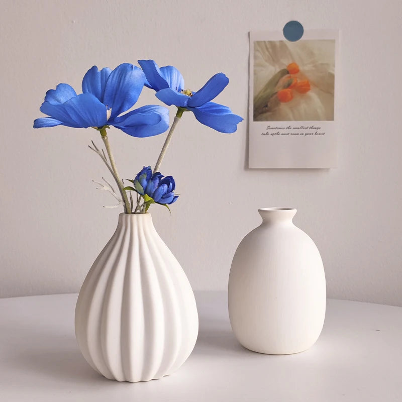 Fluted Bud Vase styled with blue flowers